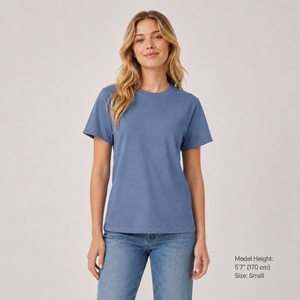 Woman wearing a blue t-shirt and jeans on a plain background